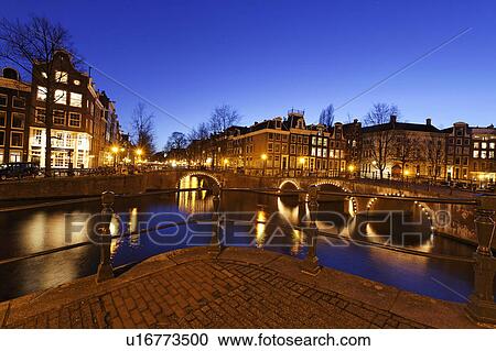 Stock Image -  water canal bridges night amsterdam bridge water . Fotosearch
