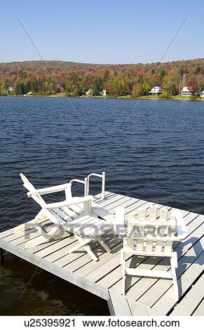Stock Image -  water home relaxing chairs in beautiful setting. Fotosearch