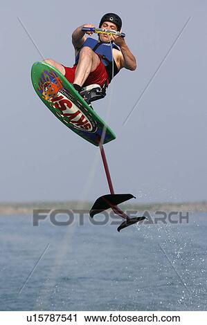 Stock Image -  water man male riding hydrofoil sky ski . Fotosearch