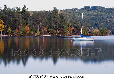 Picture -  water peaceful quiet scene lake small boat . Fotosearch