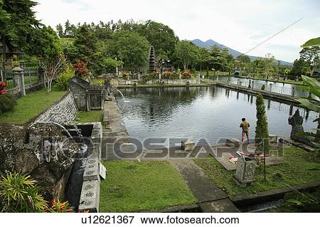 Stock Photo -  water people person indonesia palace tirta bali . Fotosearch