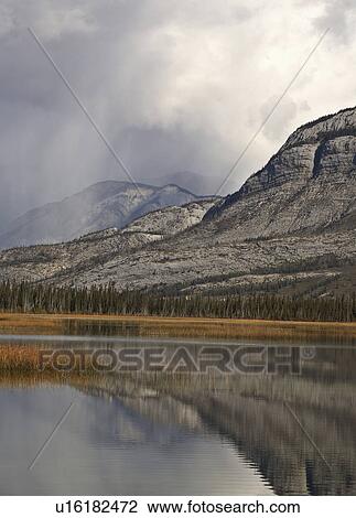 Stock Image -  water snow clouds in rocky mountains alberta. Fotosearch