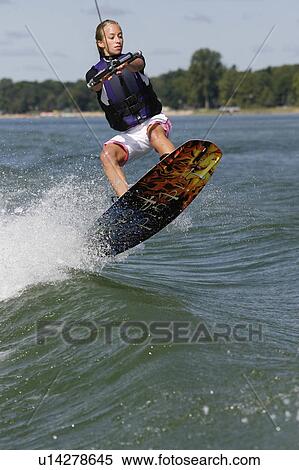 water summer girl teenage riding wakeboard lake View Large Photo Image Stock Photography - water summer girl teenage riding wakeboard lake . Fotosearch