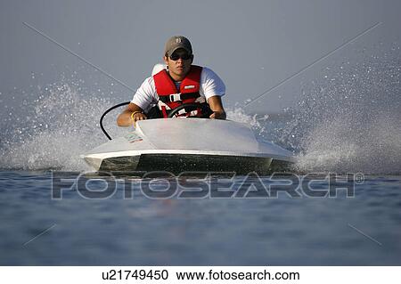 water teenage boy in hydroplane boat View Large Photo Image Stock Image - water teenage boy in hydroplane boat. Fotosearch