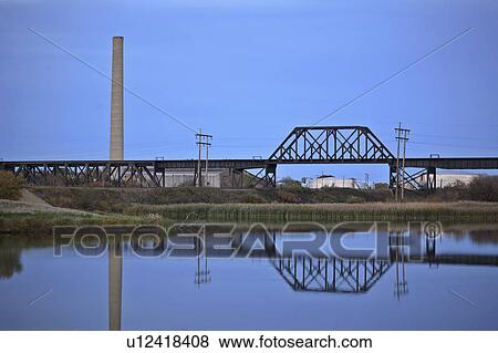 Stock Photo -  water wakamow lake in moose jaw reflected calm. Fotosearch