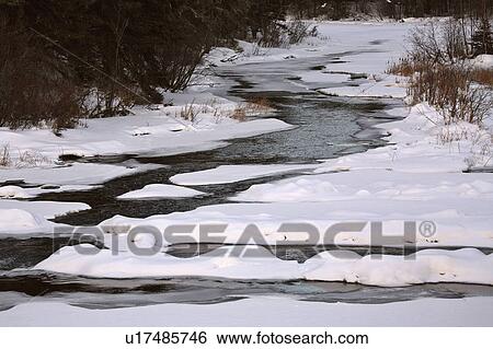 Stock Photograph -  water winter art waskesui river in frozen ice. Fotosearch
