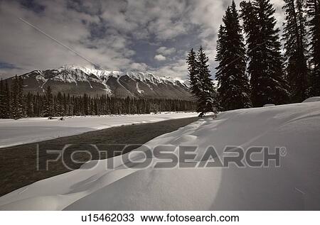 Stock Image -  water winter open in snow covered clouds clear. Fotosearch