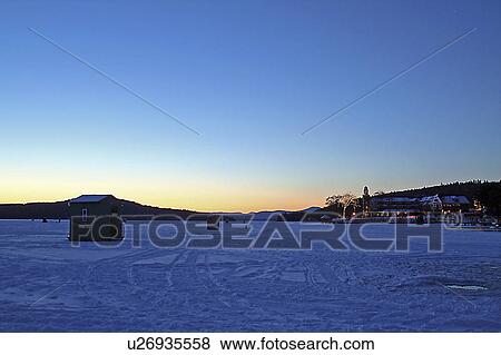 Stock Photo -  winter meredith new hampshire ice fishing lake . Fotosearch