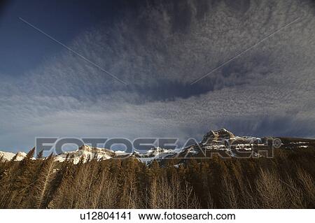winter rocky mountains in snow covered clouds View Large Photo Image Stock Image - winter rocky mountains in snow covered clouds. Fotosearch