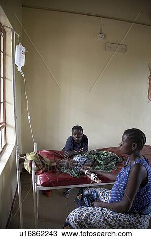 Stock Image -  woman baby people person women tanzania sick sub. Fotosearch