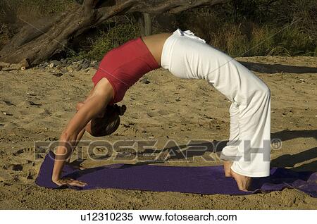 woman beach fitness model performing yoga pose View Large Photo Image Stock Photography - woman beach fitness model performing yoga pose. Fotosearch