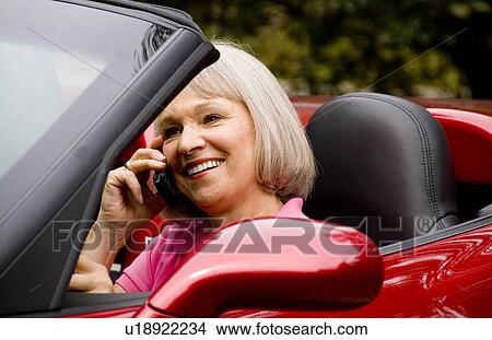Picture -  woman car attractive retired successful in 60s . Fotosearch