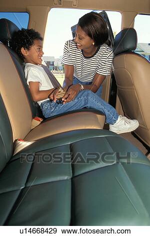 Stock Photo -  woman car child kid 30-35 years 5-6 african boy. Fotosearch