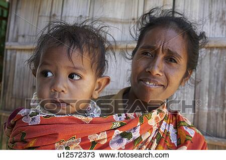 Stock Image -  woman child face women timor leste mother aileu. Fotosearch