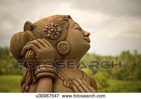 Stock Photo -  woman design art balinese stone bali indonesia. Fotosearch