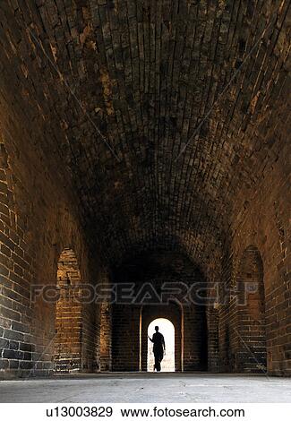 woman female standing in arched door way opening View Large Photo Image Stock Photo - woman female standing in arched door way opening . Fotosearch
