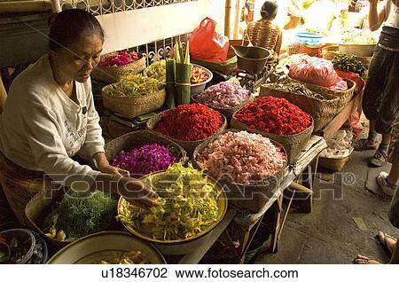 Stock Image -  woman flowers markets in bali indonesia market. Fotosearch