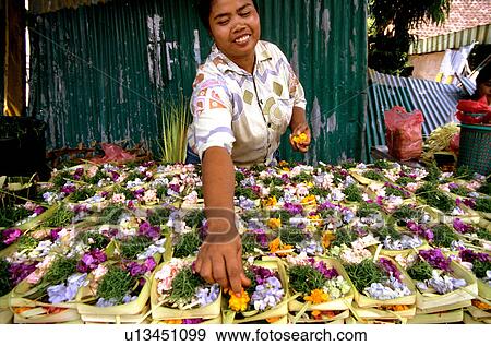 Stock Photo -  woman flowers person 35-40 years arranging asia. Fotosearch