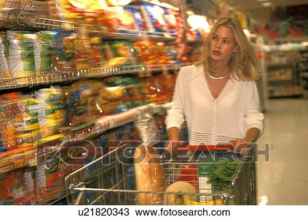 Stock Image -  woman food person 25-30 years blonde browsing. Fotosearch