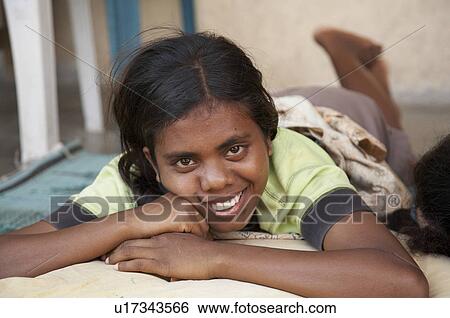 Stock Photograph -  woman girl face home women timor leste topu east. Fotosearch