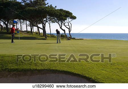 woman golf man golfing expensive ocean club View Large Photo Image Stock Image - woman golf man golfing expensive ocean club . Fotosearch