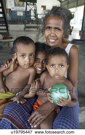 Stock Photo -  woman people child children women timor leste. Fotosearch