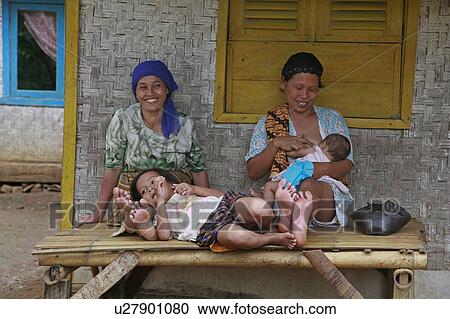 Stock Image -  woman people child person children women village . Fotosearch