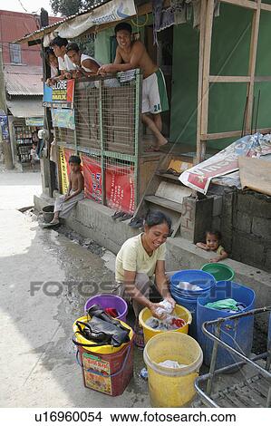 Picture -  woman people person washing clothes youths look . Fotosearch