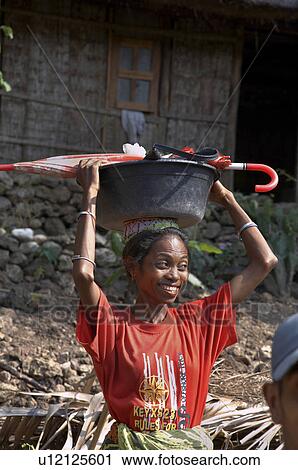 woman timor leste female carrying plastic bowl View Large Photo Image Stock Image - woman timor leste female carrying plastic bowl. Fotosearch