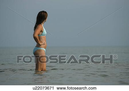 woman water girl bikini young female in standing View Large Photo Image Stock Image - woman water girl bikini young female in standing . Fotosearch