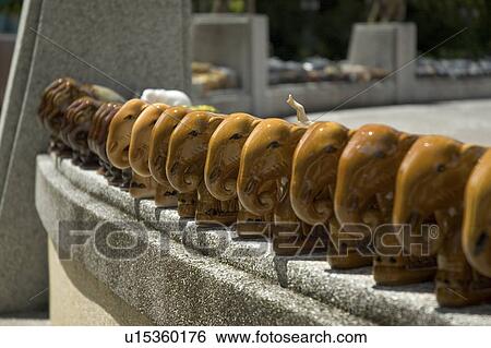 wooden elephants lined up in offering buddha View Large Photo Image Stock Photograph - wooden elephants lined up in offering buddha. Fotosearch