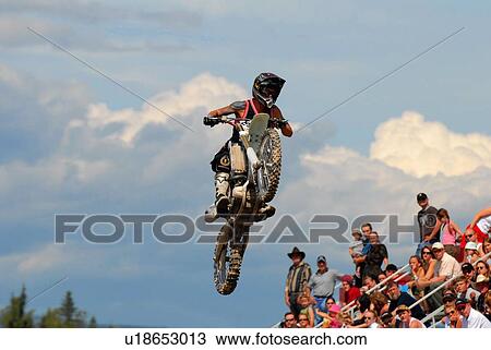 background motocross rider performing stunt air View Large Photo Image Stock Image - background motocross rider performing stunt air. Fotosearch
