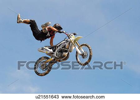 background motocross rider performing stunt air View Large Photo Image Stock Image - background motocross rider performing stunt air. Fotosearch