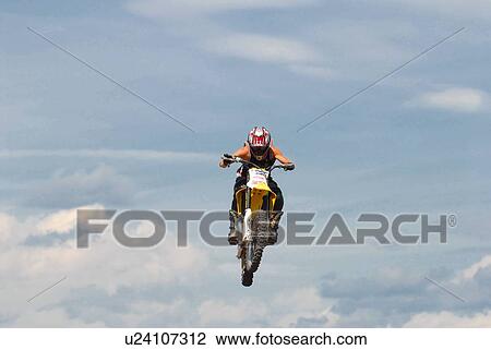 background motocross rider performing stunt air View Large Photo Image Stock Image - background motocross rider performing stunt air. Fotosearch