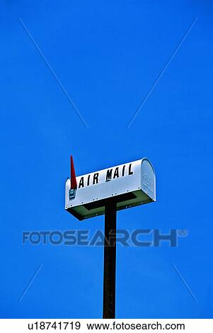 Stock Photo -  background rural mail box flag up in blue sky. Fotosearch