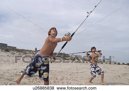 beach love child sport fish children kid two View Large Photo Image Stock Photo - beach love child sport fish children kid two . Fotosearch