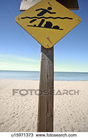 Stock Image -  beach water art swimmers warning sign lake shore. Fotosearch