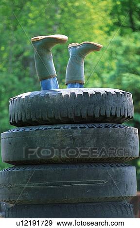 boots legs sticking out stack old discarded in View Large Photo Image Stock Photo - boots legs sticking out stack old discarded in. Fotosearch