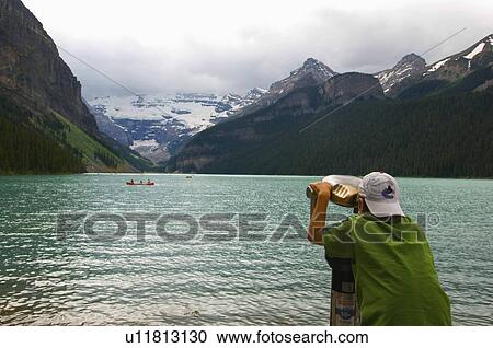 boy binocular viewer look glacier ai lake louise View Large Photo Image Stock Image - boy binocular viewer look glacier ai lake louise. Fotosearch