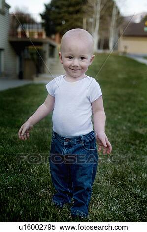 Stock Photography -  child beauty young boy in white tshirt jeans imp. Fotosearch