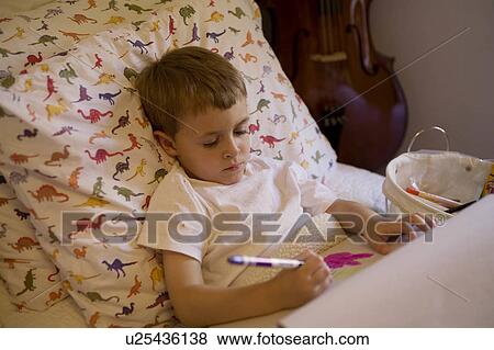 child young boy drawing in bed bedtime usa draw View Large Photo Image Stock Photo - child young boy drawing in bed bedtime usa draw. Fotosearch