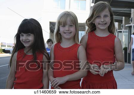 children kids girls siblings matching smiling View Large Photo Image Stock Photo -  children kids girls siblings matching smiling. Fotosearch