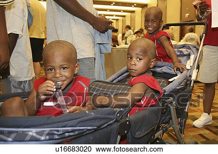 Stock Image -  children triplets brothers kids siblings looking. Fotosearch