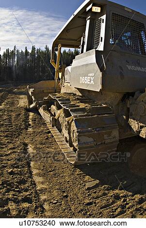 construction rear view large bull dozer pushing View Large Photo Image Stock Image - construction rear view large bull dozer pushing. Fotosearch