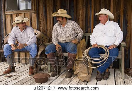 cowboy life in usa west cowboys relax talk old View Large Photo Image Stock Photo - cowboy life in usa west cowboys relax talk old. Fotosearch