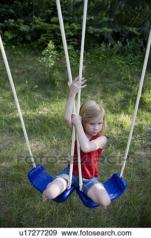 family girl child young in red shirt jean shorts View Large Photo Image Stock Photo - family girl child young in red shirt jean shorts. Fotosearch