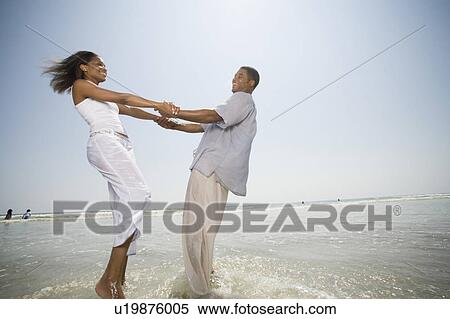 family woman beach water love people summer girl View Large Photo Image Stock Photography - family woman beach water love people summer girl . Fotosearch