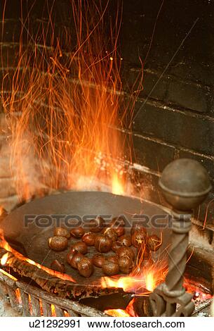 food fire roasting chestnuts open country inn View Large Photo Image Stock Image - food fire roasting chestnuts open country inn . Fotosearch