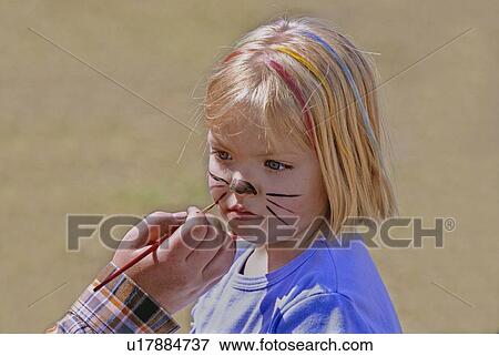 Stock Photo -  girl child cat face children kid young blond . Fotosearch