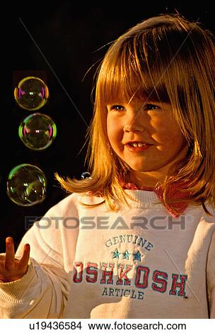 girl child four year old blond catching some View Large Photo Image Picture - girl child four year old blond catching some . Fotosearch